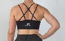 NICKI_BLACK_SHORT+BRA_BACK ZOOMED.webp