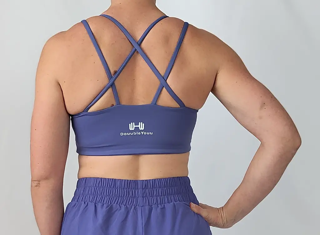 NICKI_BLUE_SHORT+BRA_BACK ZOOMED.webp